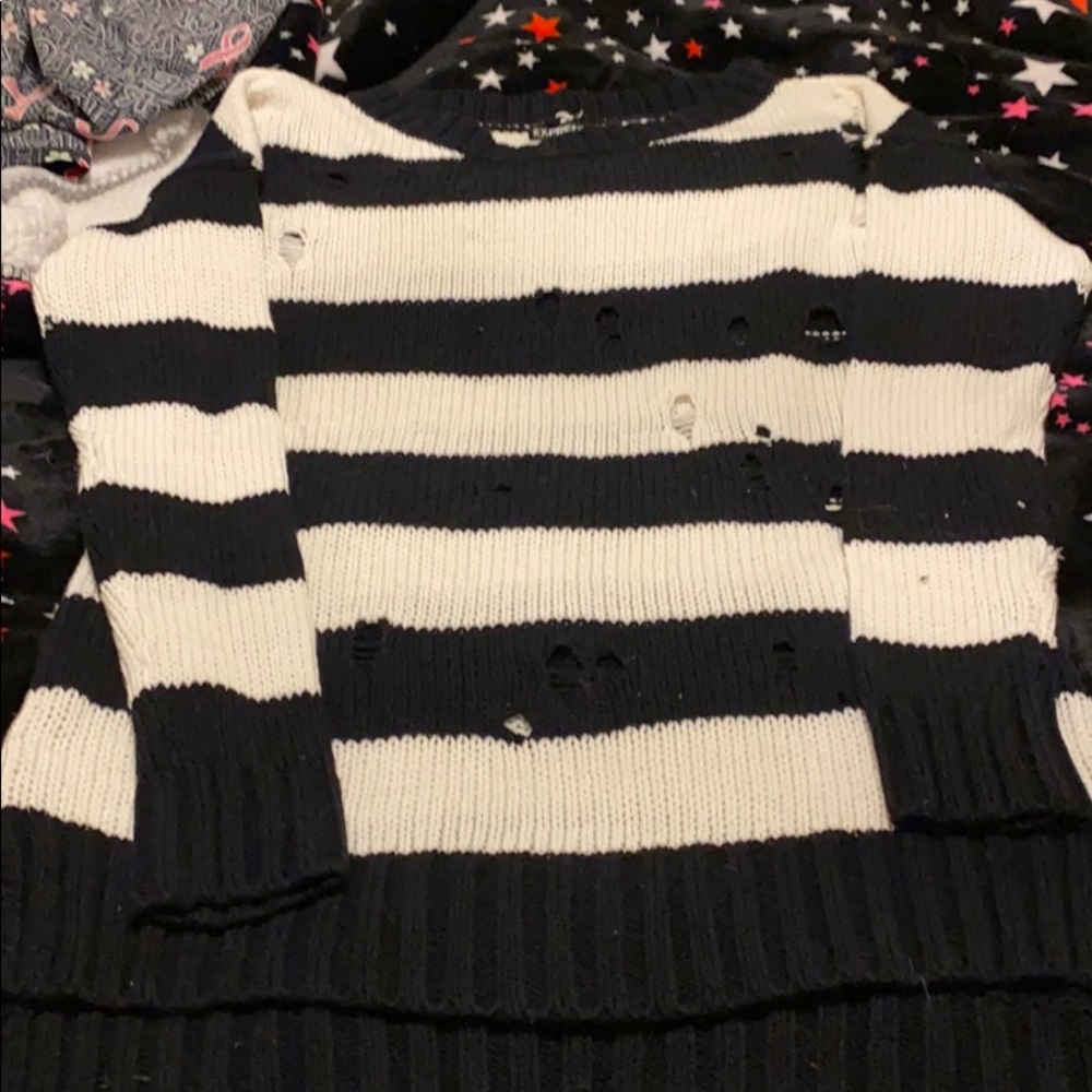 Hi low black stopped sweater with holes